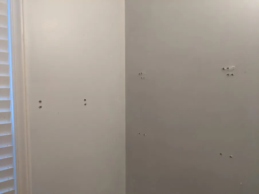 Once the 'attachments' were removed from the walls, dozens of holes needed to be repaired.