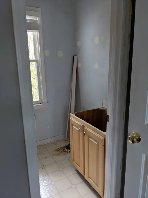 An image of a very sad room, but now the toilet is missing