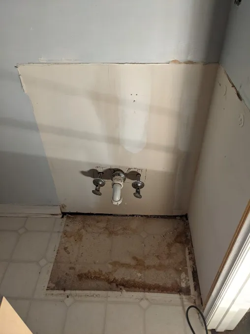 The vanity is missing now, and there was a lot of dirt under it