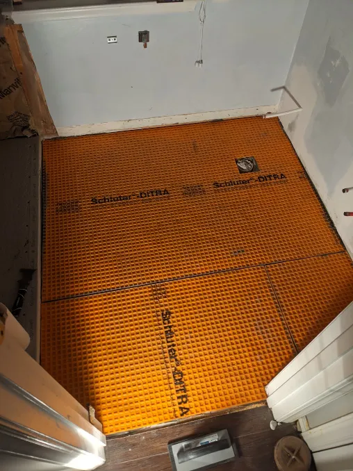 The floor is entirely covered with orange plastic