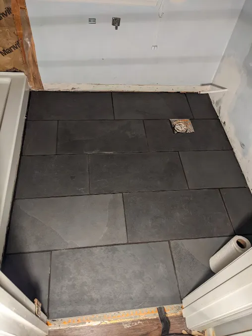 Those same tiles have been secured to the floor with mortar
