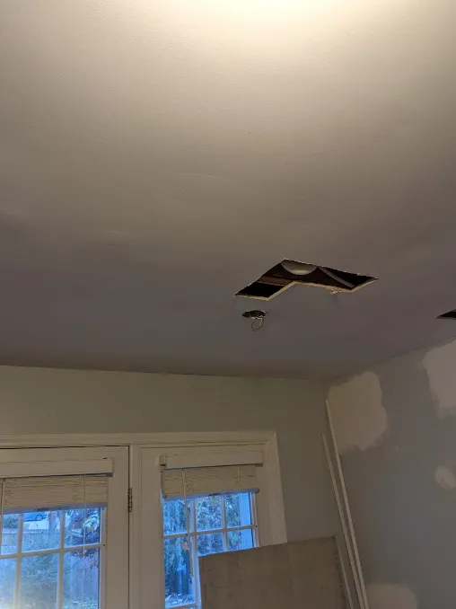 A picture of a ceiling, with a massive hole cut out of it