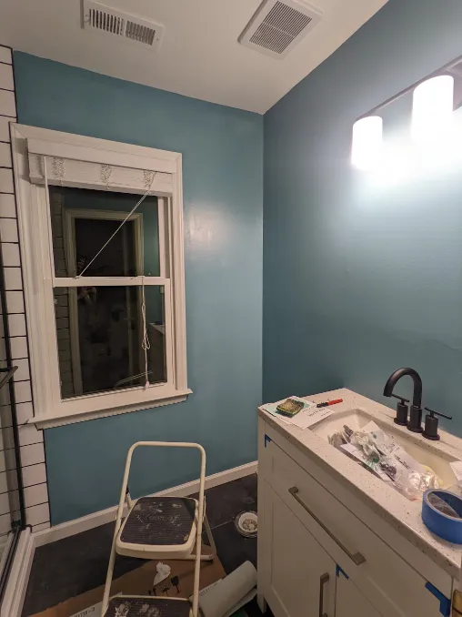 The whole room is painted a clean, cooling color