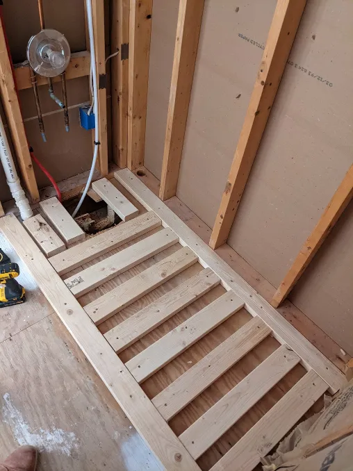 Boards have been attached to the floor, forming a platform