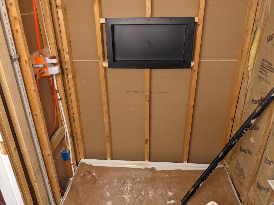 A plastic niche sits in the window created in the previous image