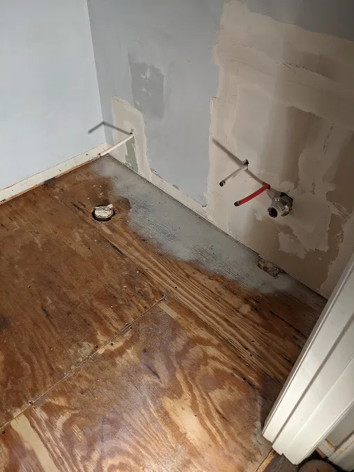 The wall has been rebuilt around the new pipes