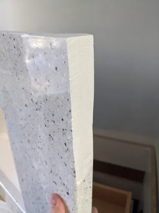 The counter top from the vanity has been ground down on its back corner