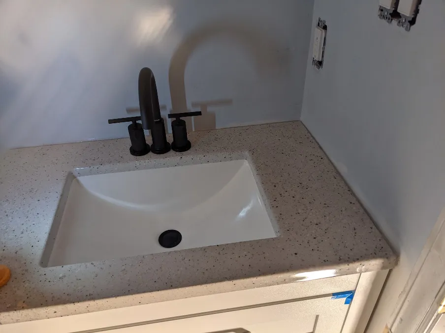 The vanity and counter top are installed, with a significantly smaller gap