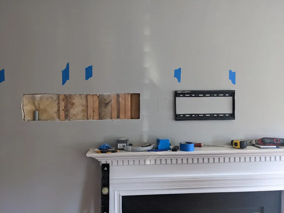 A hole has been cut in the drywall, about 8 inches tall, but about 3 feet wide