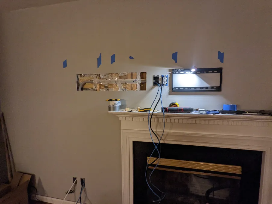 A plastic barrier has been repaired in front of the pipe