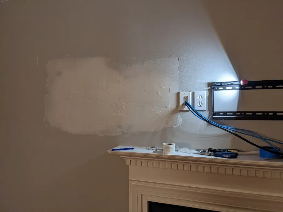 Drywall mud has been added to the patch to fill the gaps